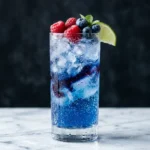 McDonald's Sprite Berry Blast copycat in a tall glass with crushed ice, blue-purple berry syrup ribboning through the Sprite, garnished with fresh raspberries and blueberries