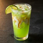 finished mountain dew dirty soda with cream ribbon and lime garnish