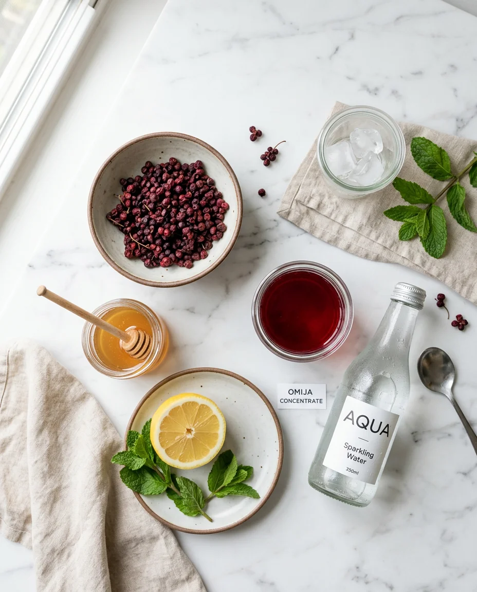 omija mocktail recipe ingredients: dried schisandra berries, honey, lemon, and deep crimson steeped liquid