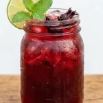 hibiscus tea recipe in a mason jar with lime and mint
