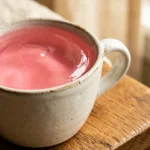 Pink cranberry gelatin drink in a ceramic mug, the Dr Oz gelatin recipe