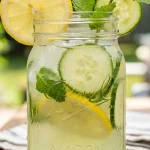 LMNT recipe electrolyte drink in a mason jar with lemon garnish